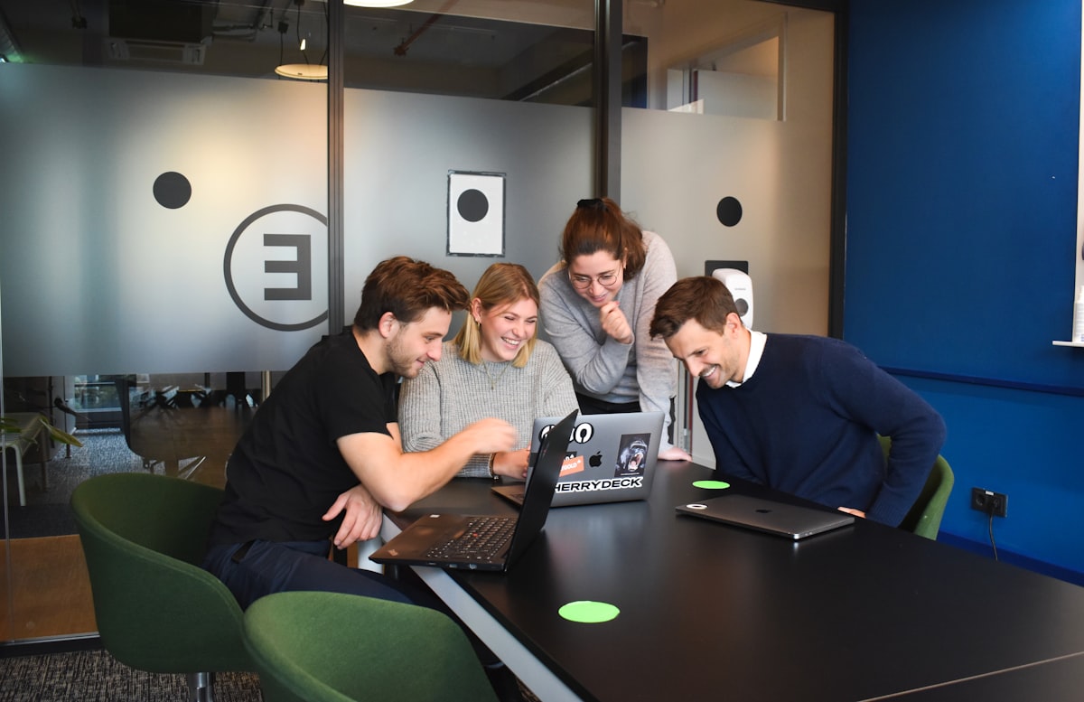 1080x600 Content team working at laptops