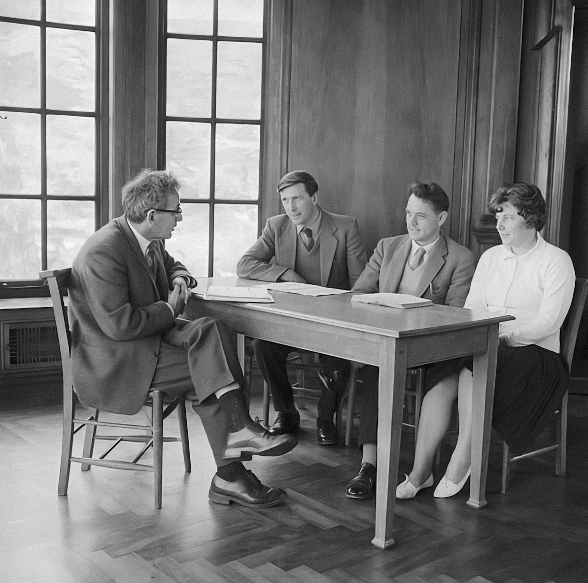 Vintage black and white photograph of a business meeting